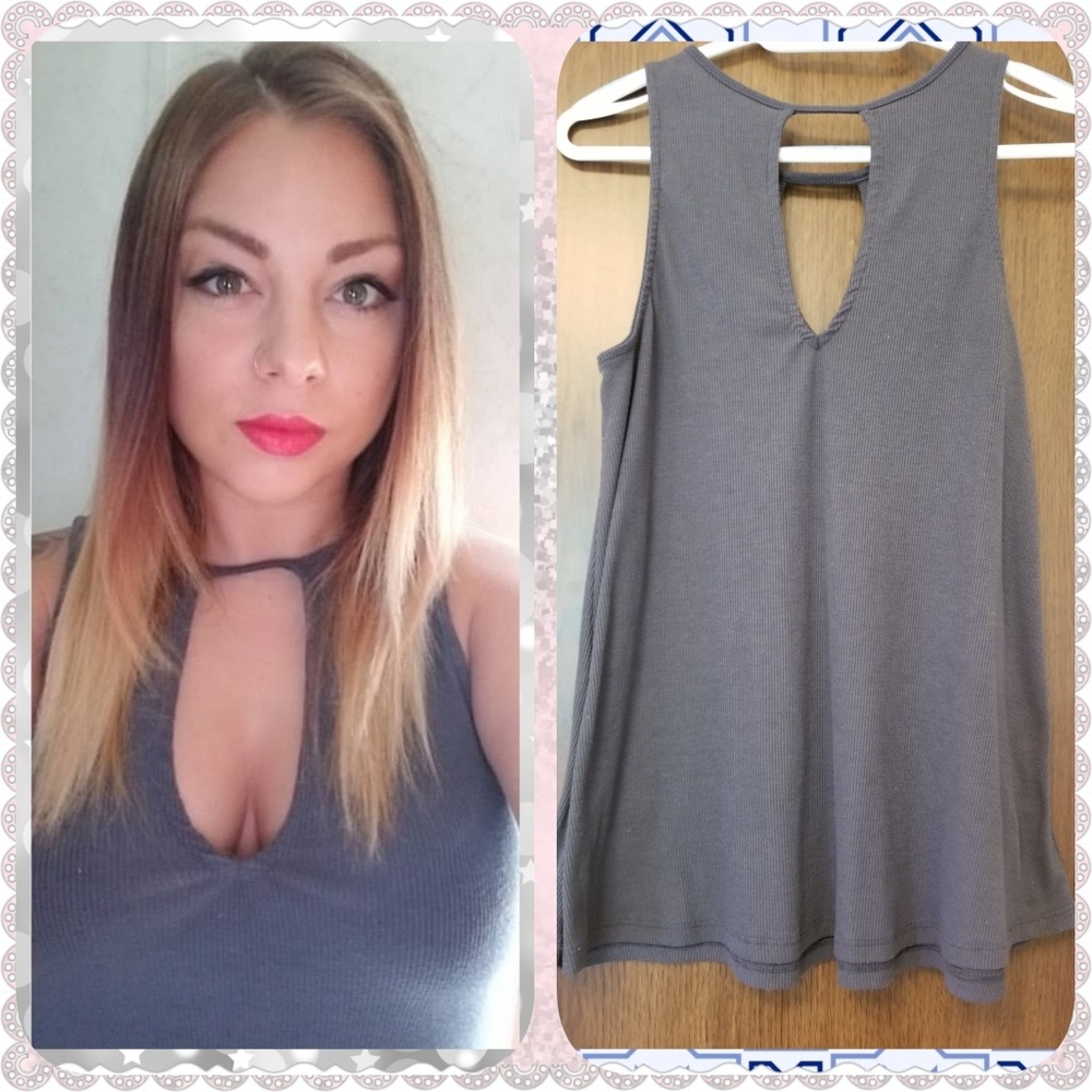 Grey low cut flowy top.
